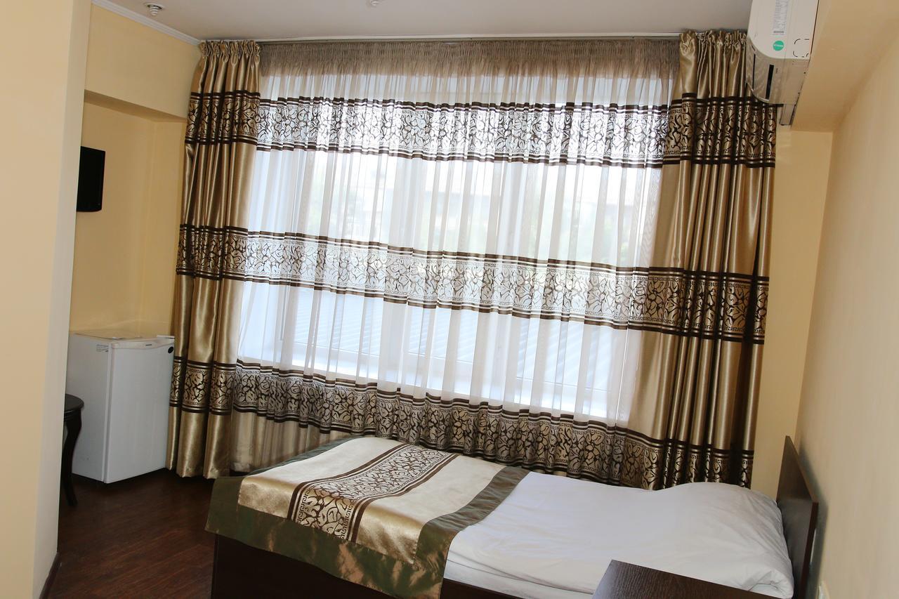 Kausar Hotel Almaty Quarto foto